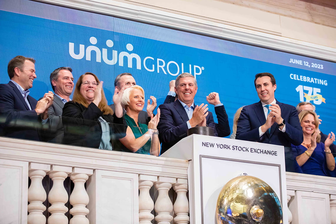 Unum Group senior leaders ringing the bell at the NYSE