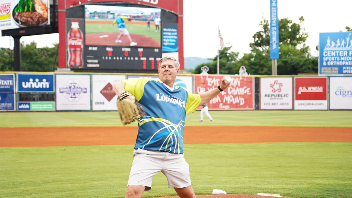Rick McKenney throwing out the first pitch at the Lookouts Unum Night