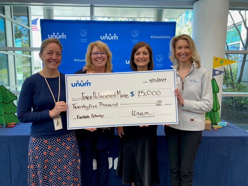 Unum Group presents donation to Junior Achievement